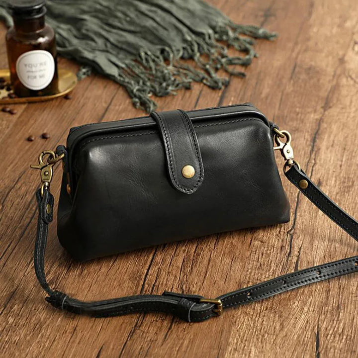 Elegant women's PU leather vintage shoulder bag. Doctor bag style crossbody handbag, ideal for fashion.