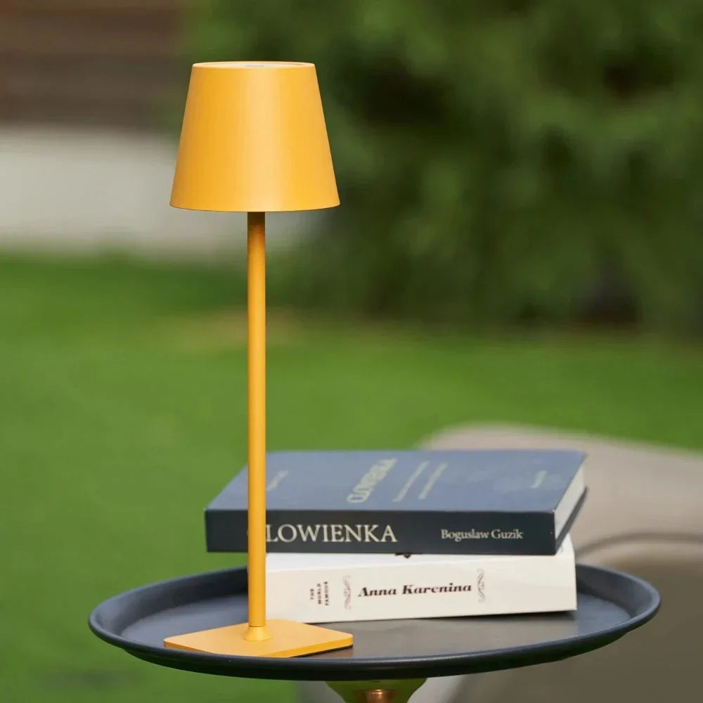 Modern portable LED lamp, dimmable for elegant bedroom or outdoor use.