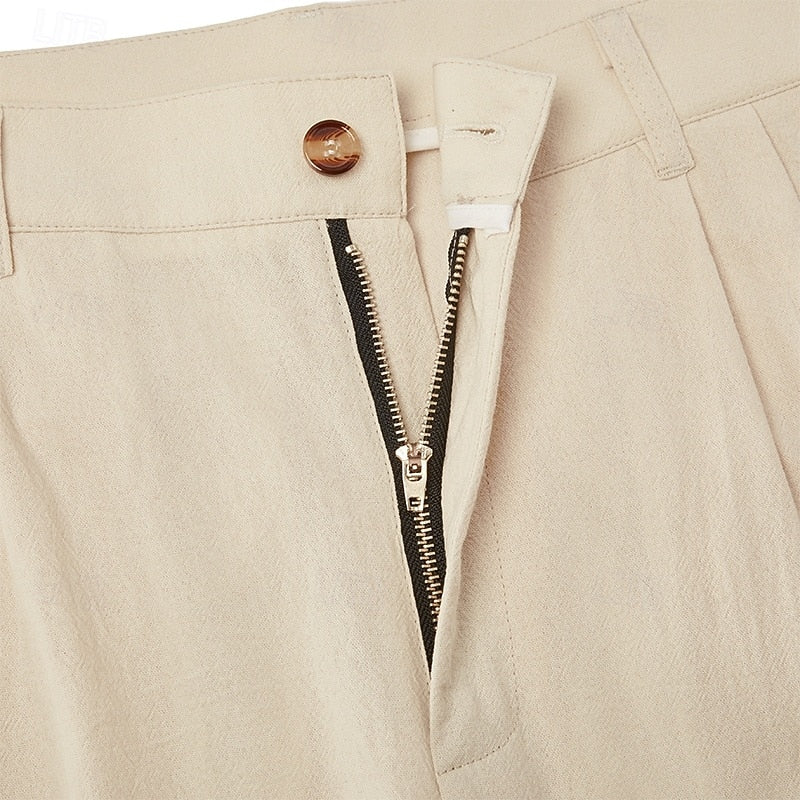 Close-up of lightweight fabric on men's relaxed fit summer trousers, highlighting breathability.