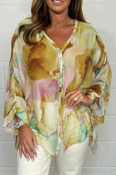 Women's Aurora airy blouse featuring a striking artistic pattern. Comfortable and stylish casual top for summer fashion.