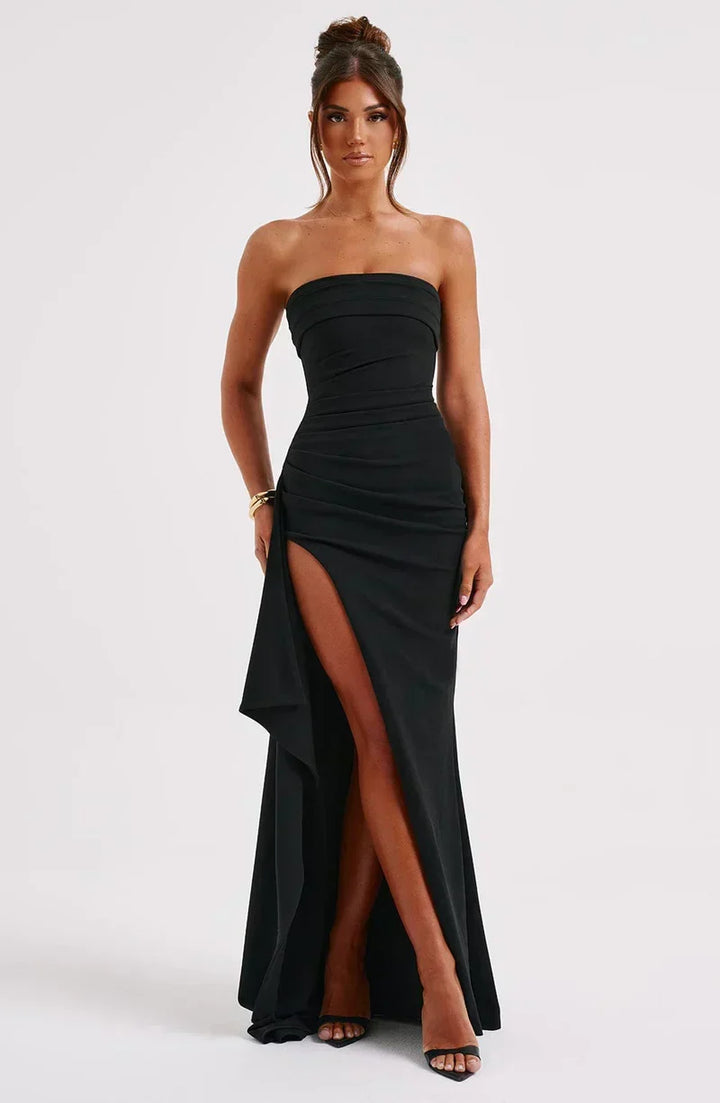 Women's sophisticated off-shoulder maxi dress with elegant twisted bodice. Perfect for evening wear.