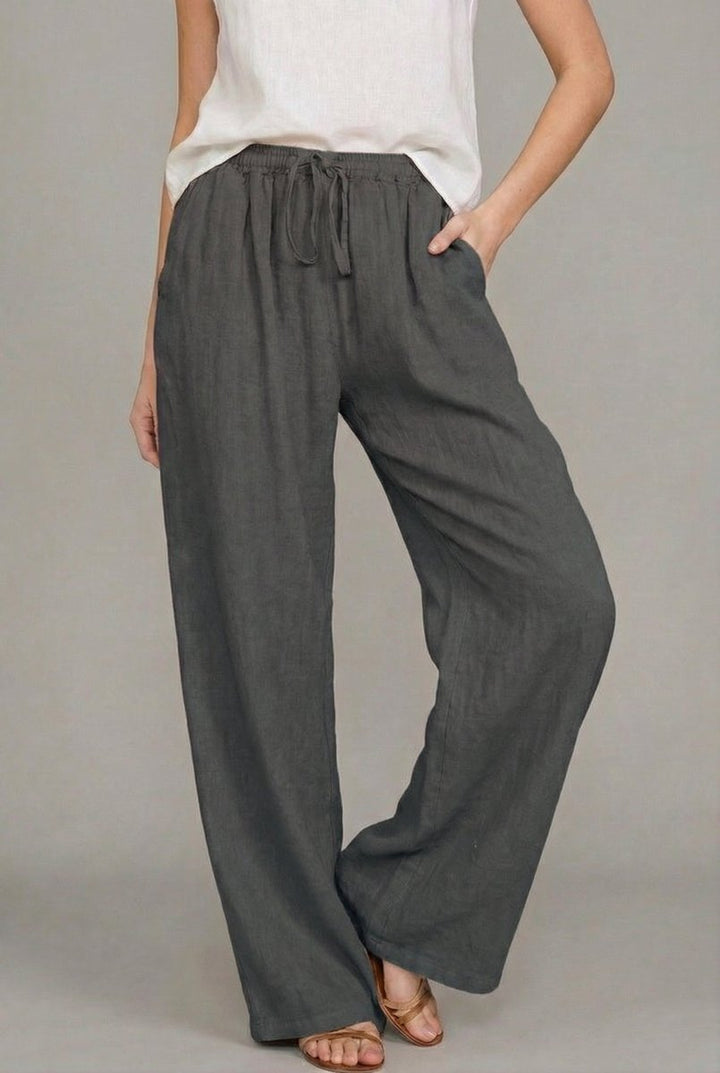 Effortless women's wide leg linen pants with adjustable drawstring, ideal for chic summer and resort wear.
