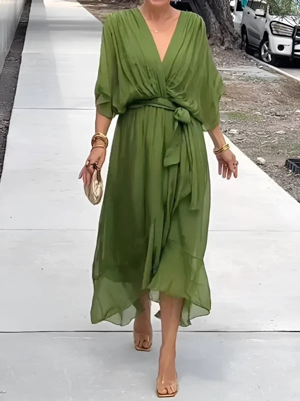 Elegant women's wrap midi dress, perfect for versatile day-to-evening style. Flattering V-neck design.