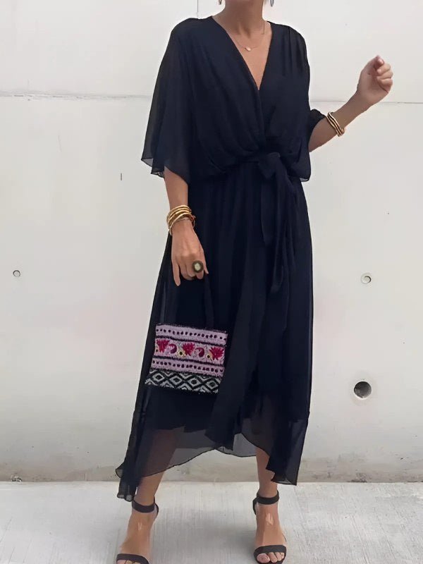 Figure-flattering women's wrap midi dress. Elegant design perfect for day-to-evening occasions and summer fashion.