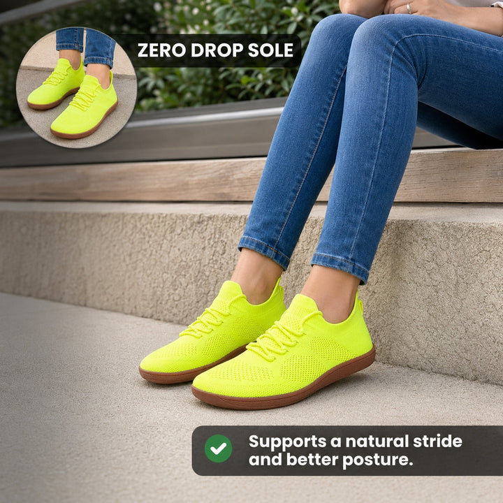 Orange comfort footwear for women, wide toe barefoot design for healthy daily walks.
