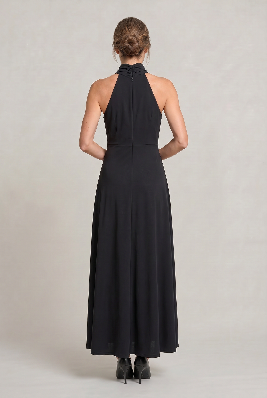 Stylish black maxi party dress for women featuring a chic halter neck. Perfect for formal occasions.