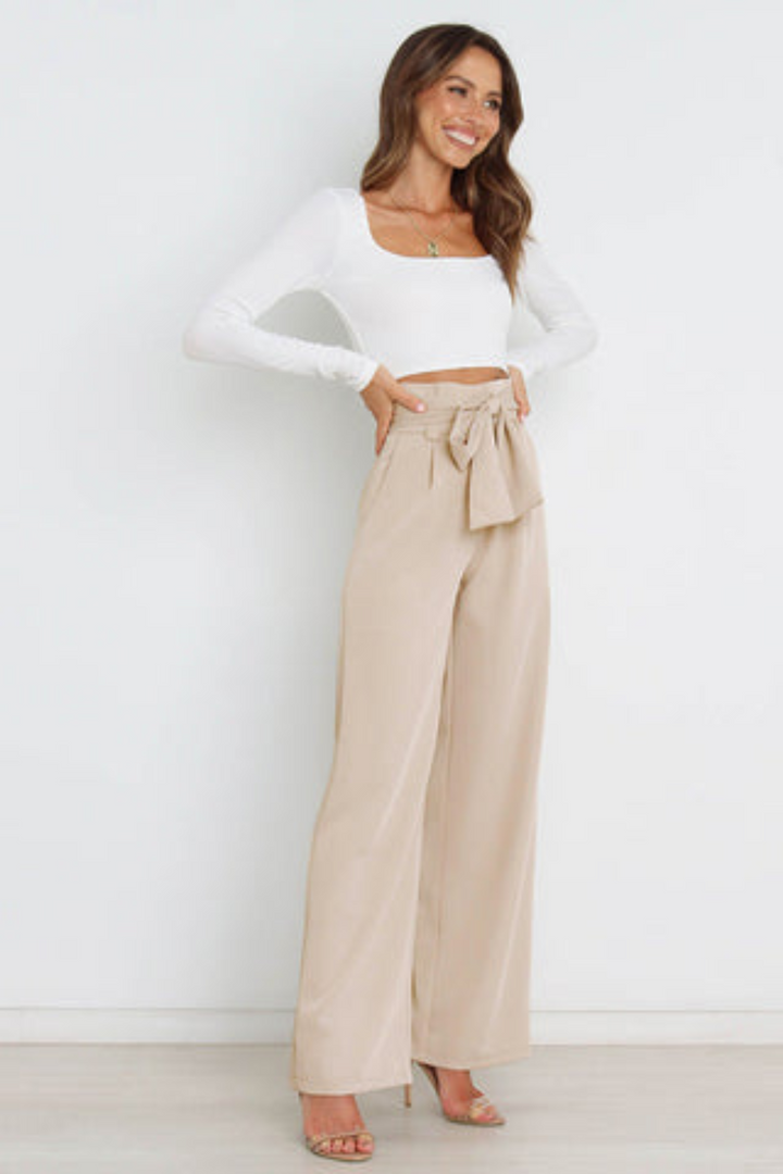 Women's sophisticated wide leg belted linen pants, flowy, versatile for elegant summer looks.