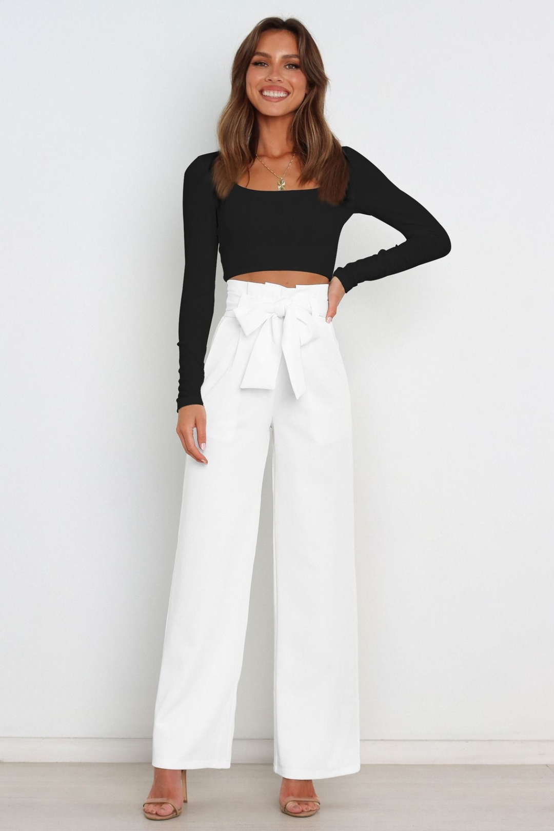 Elegant women's flowy wide leg linen pants, high waist, belted, perfect for summer fashion.