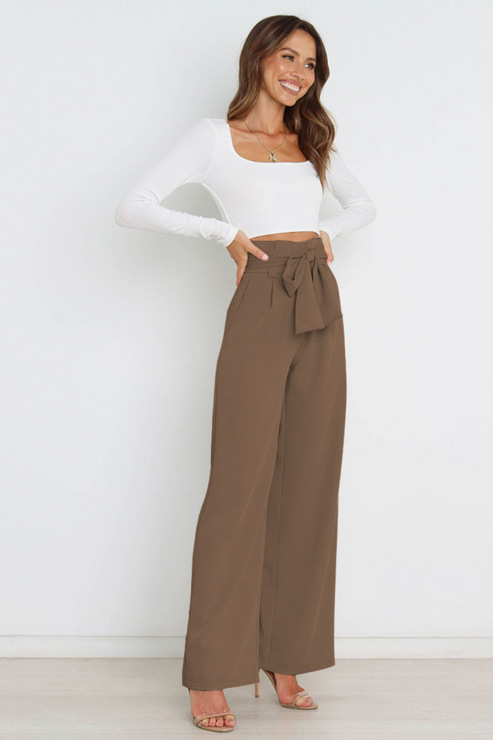 Women's high waist wide leg linen pants, flowy and belted, ideal for sophisticated summer style.