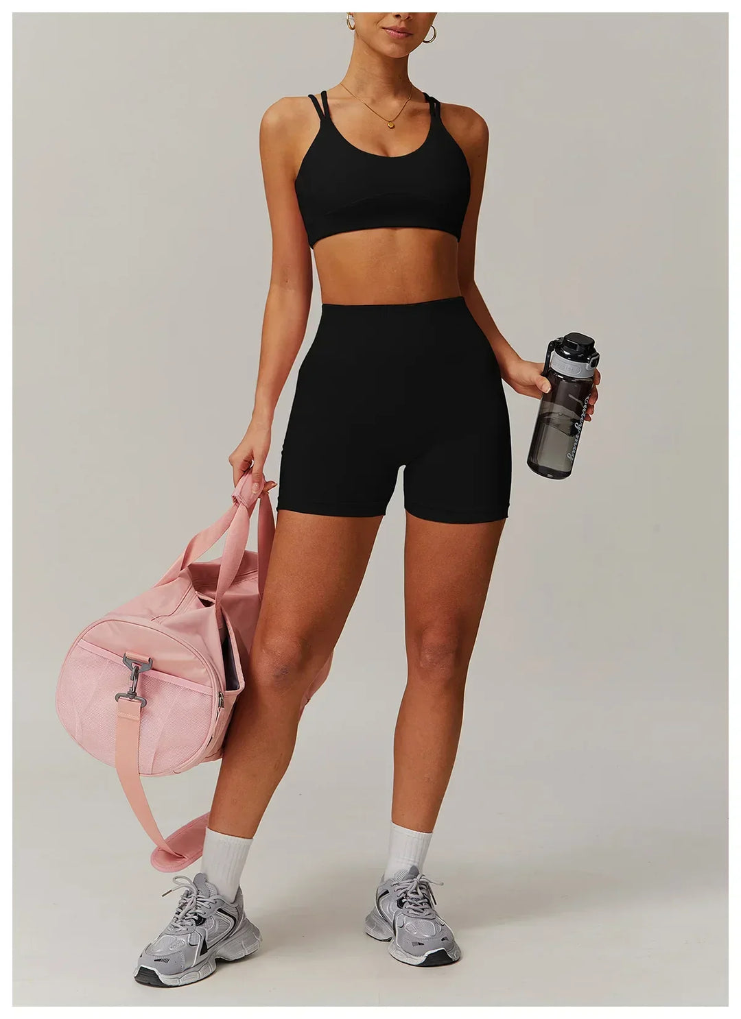 Stylish women's activewear set with high-waisted bike shorts & crop top. Great for workouts & casual wear.