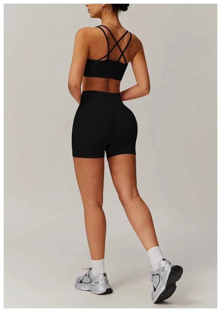 High-waisted bike shorts activewear set for women. Comfortable fitness clothing with a stylish crop top.