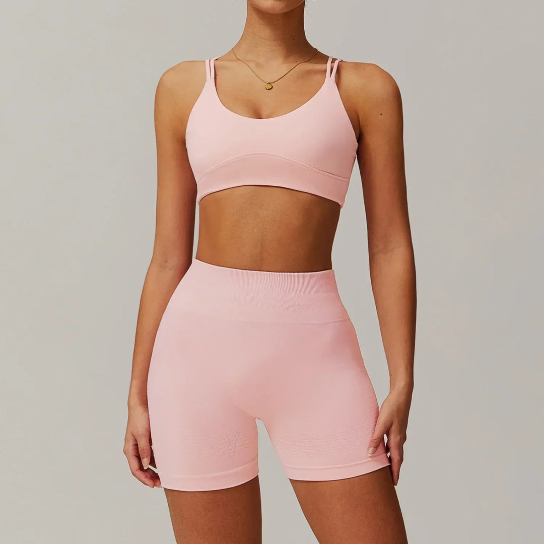 Women's yoga wear set: stylish high-waisted bike shorts & matching crop top. Comfortable for all poses.