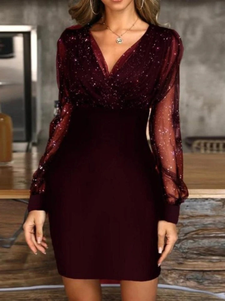 Glamorous women's sequin cocktail dress with sheer long sleeves. A dazzling bodycon mini dress for evening events.