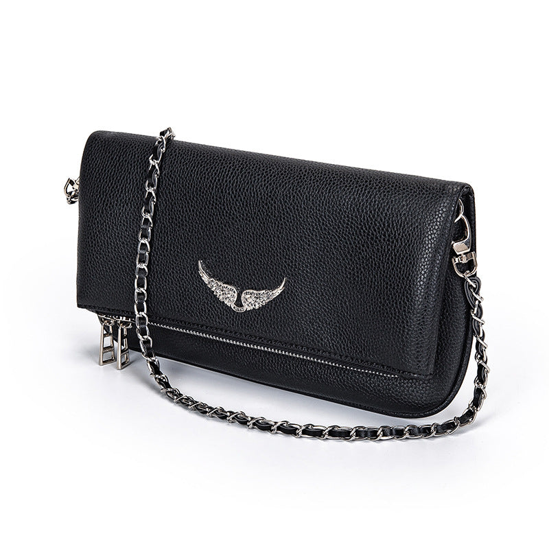 Stylish black women's luxury clutch handbag, perfect as an elegant evening bag or daily fashion accessory.