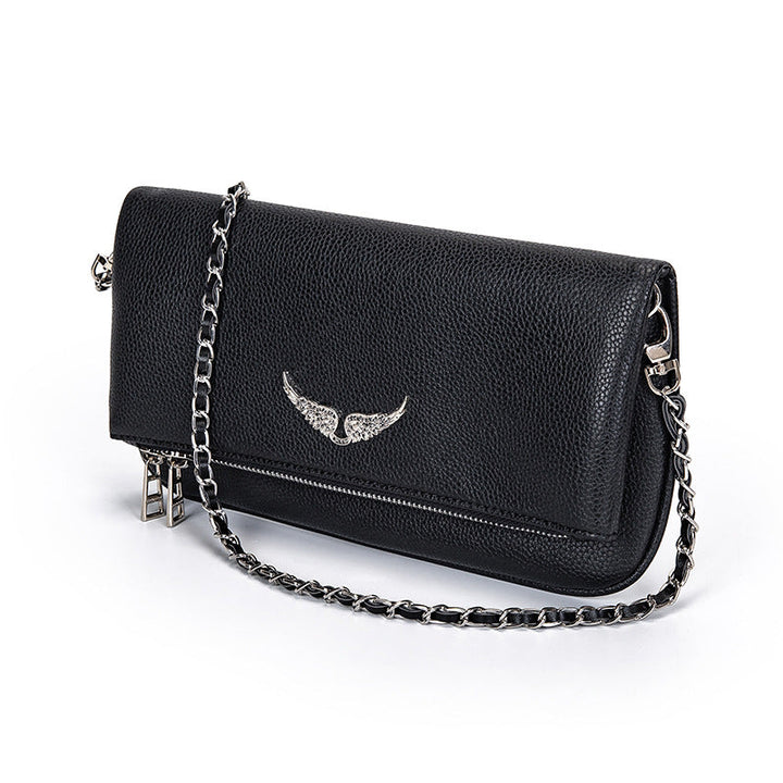 Stylish black women's luxury clutch handbag, perfect as an elegant evening bag or daily fashion accessory.